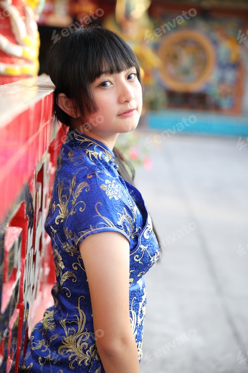 Preview: Beauty Woman Wear Red Cheongsam Looking And Smile In Chinese New Year