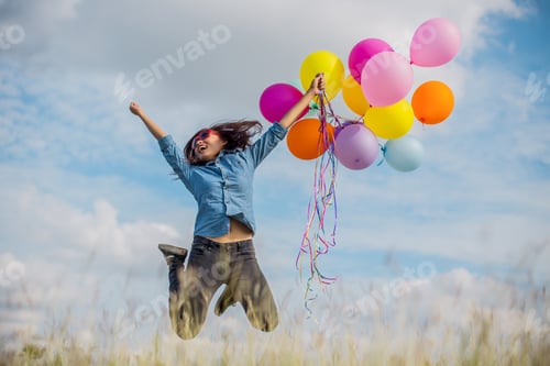 Preview: Beautiful Girl Jumping With Balloons On The Beach
