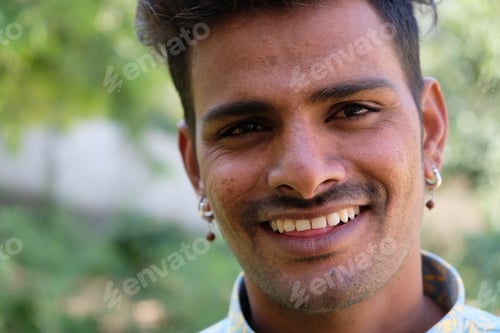 Preview: A Portrait Of A Young Smiling Indian Male In A Park