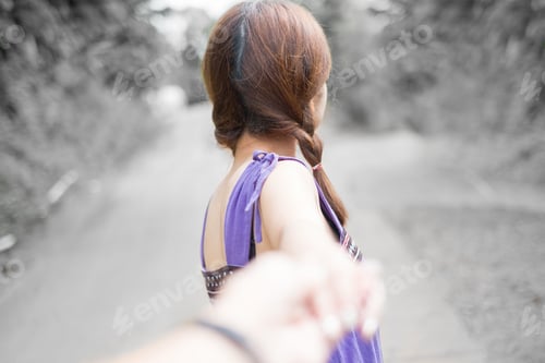 Preview: Young Couple In Love Walking In The Park And Holding Hands
