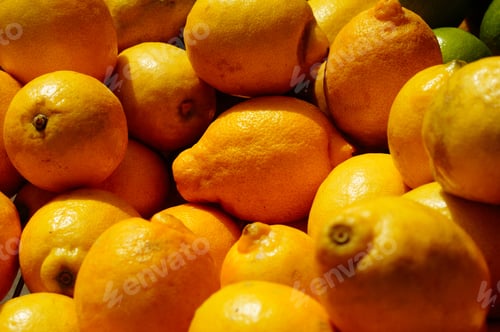 Preview: Lemons On A Market Stall Shimmer Yellow In The Sun