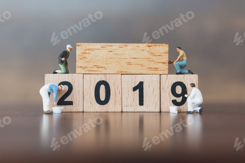 Preview: Miniature Worker Team Painting On Wooden Block , Happy New Year 2019 Concept
