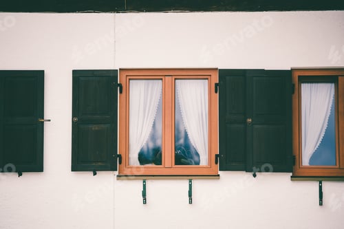 Preview: A Glass Window With A Wooden Frame And A White Curtain Inside