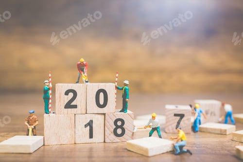 Preview: Miniature People : Worker Team Building Wooden Block Number 2018 On Wooden Background