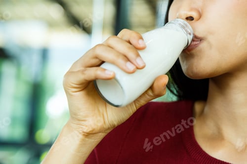 Preview: A Young Girl Is Drinking Milk.