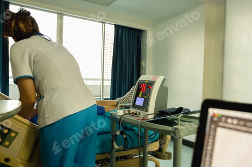 Preview: Nurse Checking Blood Pressure On Monitor Screen For Patient Health In Hospital