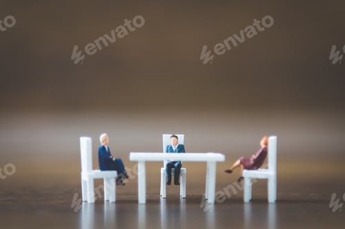 Preview: Miniature People Team Sitting Down On The Chair And Space For Text
