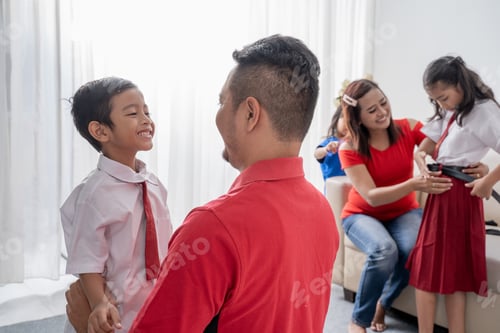 Preview: Father Help Her Son Getting Ready For School In The Morning At Home