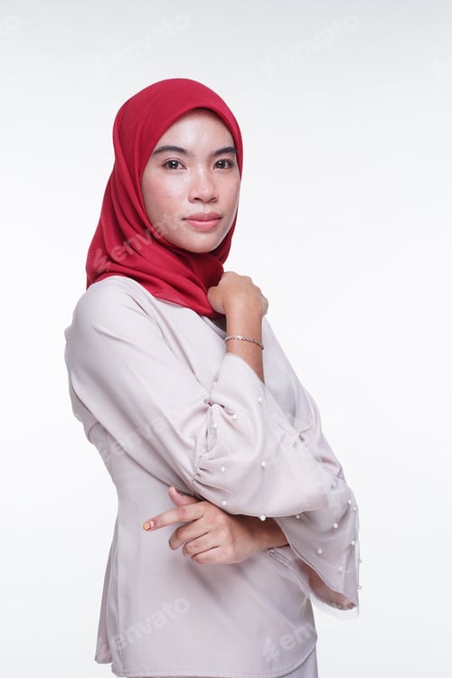 Preview: A Beautiful Muslim Female Model In A Cream Colored Modern Kebaya With Red Hijab, An Asian Muslim