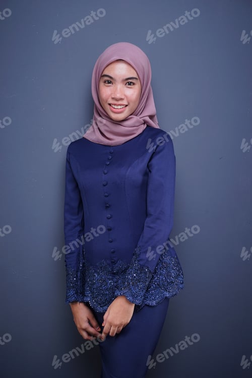 Preview: An Attractive Muslim Female Model Wearing A Dark Blue Modern Kebaya With Hijab, An Asian Muslim