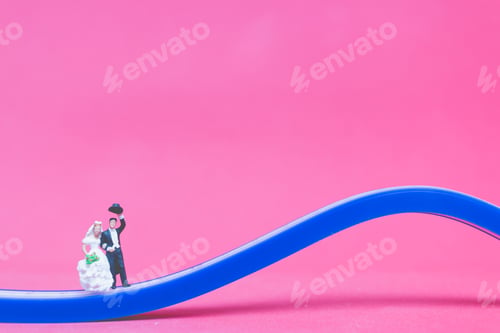 Preview: Miniature People Wedding , Bride And Groom On The Bridge On Pink Background , Valentine'S Day