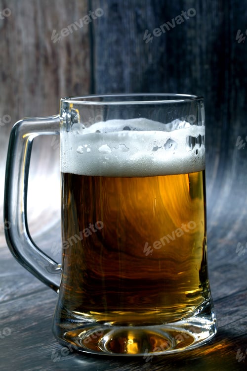 Preview: A Vertical Shot Of A Mug Of Beer On Wooden Table