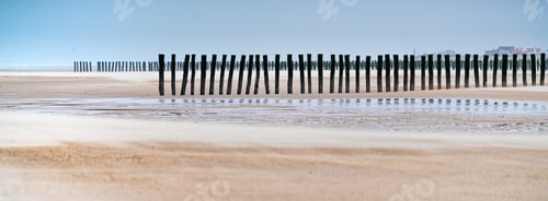 Preview: A Panorama Of Vertical Wooden Planks In The Sand Of An Unfinished Wooden Dock At The Beach In France