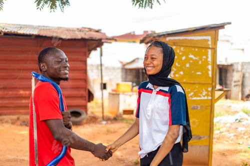Preview: An African Carpenter Smiling As He Shakes His The Hand Of His Client