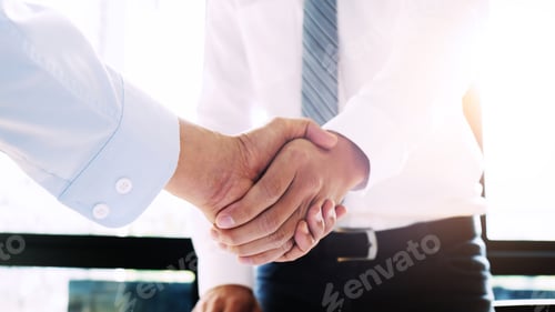 Preview: Two Confident Business Man Partner Shaking Hands In Meeting Room