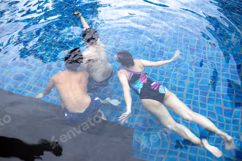 Preview: Group Of Friends Taking Selfie Under The Water In Swimming Pool Resort With Waterproof Cell Phone
