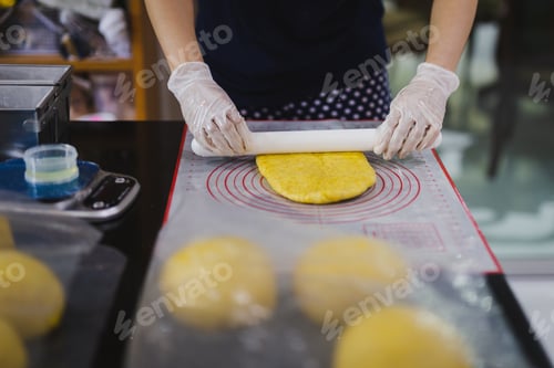 Preview: Woman Hands Kneading Dough Making Bread With A Rolling Pin