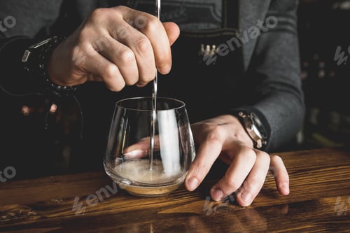 Preview: Barman Making And Serving A Cocktail