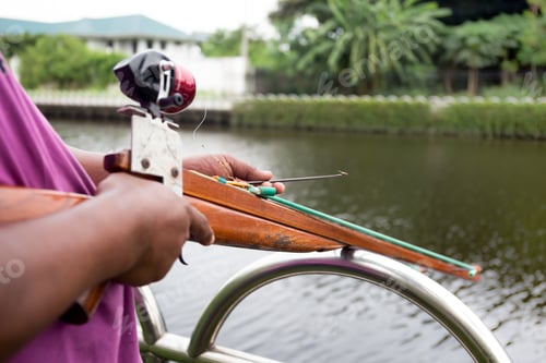 Preview: Man Preparing Speargun For Spearfishing On The River