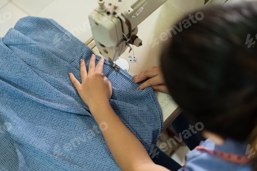 Preview: Top View Of Women Tailors Working With Sewing Machines In The Garment Convection Production Room