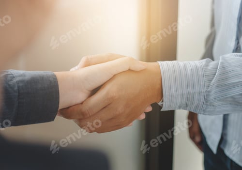 Preview: Business Partnership Meeting Handshake In Office Room.