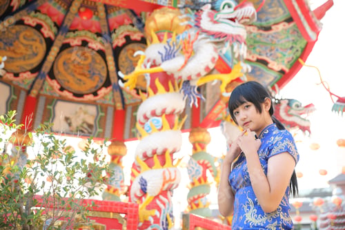Preview: Beauty Woman Wear Blue Cheongsam Looking And Smile In Chinese New Year