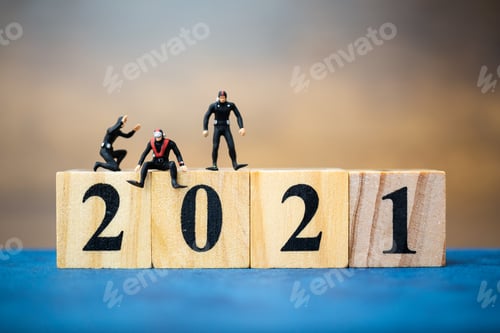 Preview: Miniature People Divers Diving Around Wooden Block 2021 , Happy New Year Concept