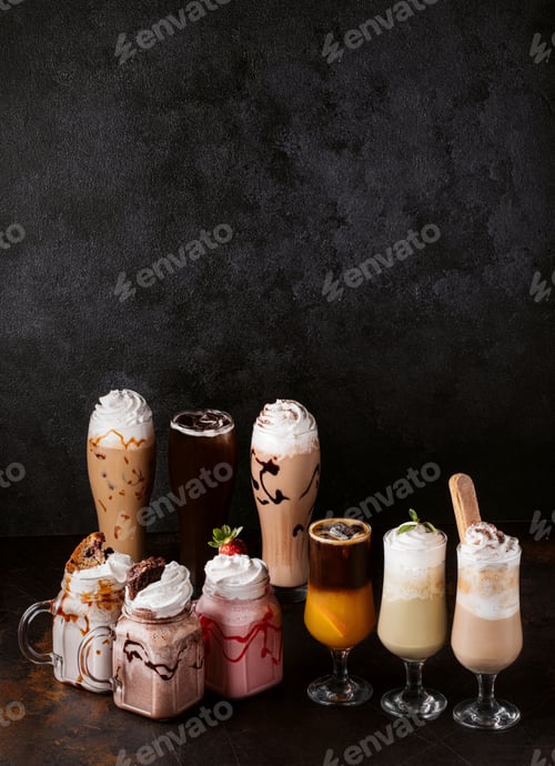 Preview: A Vertical Shot Of Tasty Coffees And Milkshakes On A Dark Background