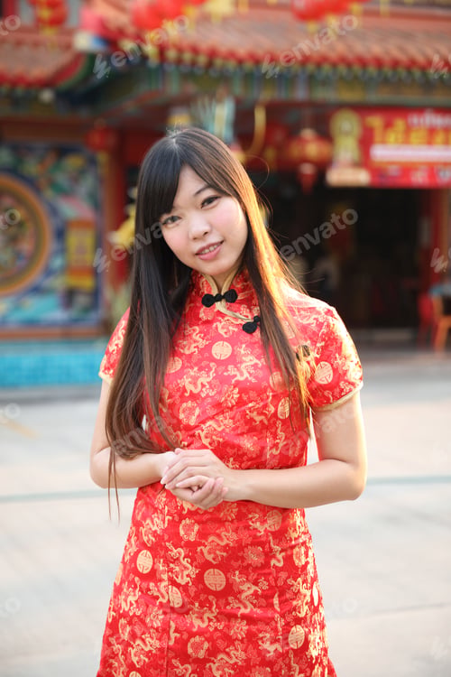Preview: Beauty Woman Wear Red Cheongsam Looking And Smile In Chinese New Year