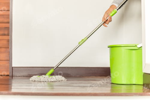 Preview: Woman'S Hand Holding A Mop Cleaning House Floor.