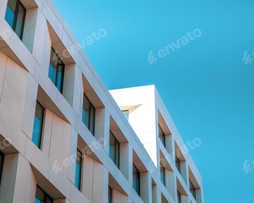 Preview: A Low Angle Shot Of A Squared Stone Building Under A Blue Sky