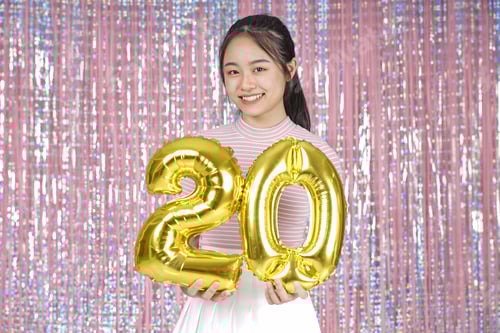 Preview: Asian Young Teenager Pretty Cheerful Beautiful Girl With Party Gold Foil Balloon, On Pink Sparkling