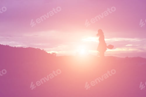 Preview: Silhouette Of Woman Praying Over Beautiful Sky Background