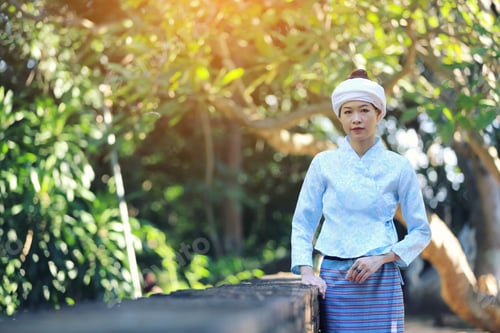 Preview: Portrait Of Thai Young Woman With Traditional Thai Dress In Thai Temple With Tree And Sunrise
