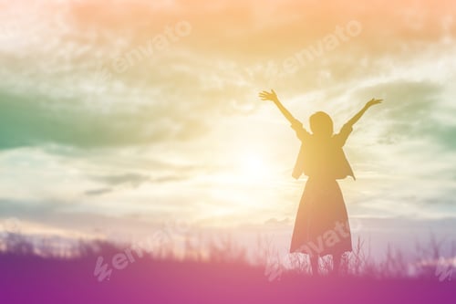 Preview: Silhouette Of Woman Praying Over Beautiful Sky Background