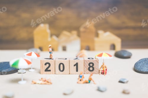 Preview: Miniature People Wearing Swimsuit Relaxing On The Beach With Wooden Block Number 2018