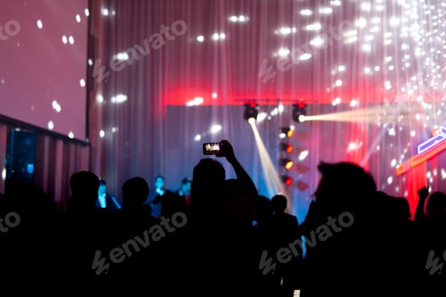 Preview: Blurred Concept At Concert Party With Audience And Colourful Led Lighting.