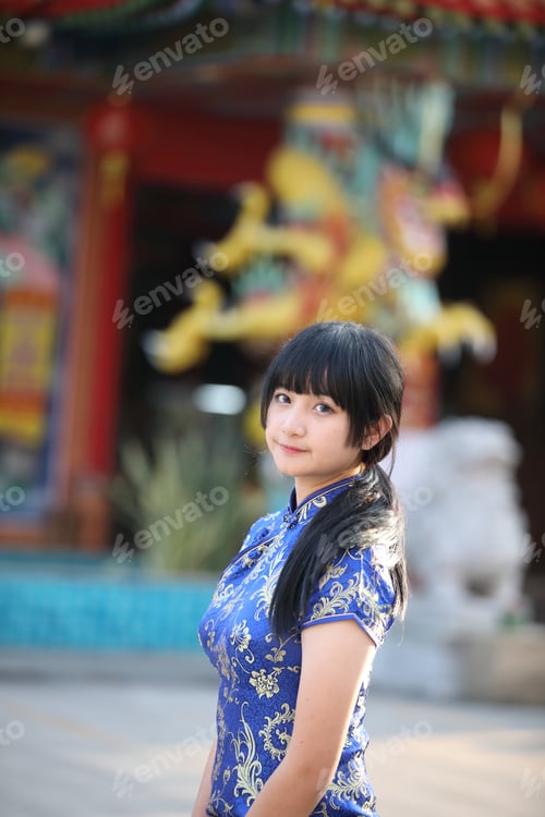 Preview: Beauty Woman Wear Red Cheongsam Looking And Smile In Chinese New Year