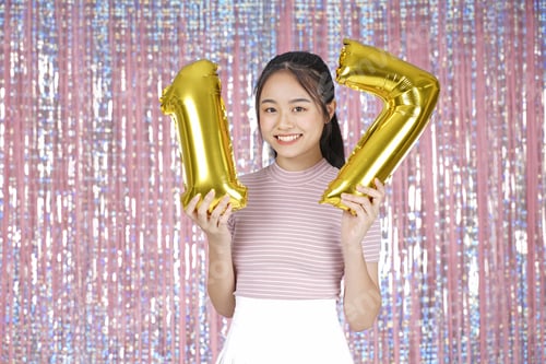 Preview: Asian Young Teenager Pretty Cheerful Beautiful Girl With Party Gold Foil Balloon, On Pink Sparkling