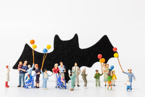 Preview: Miniature People: Happy Family Holding Balloon On White Background Happy Halloween Concept