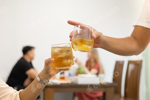 Preview: Friends Toasting Glass Of Whiskey Celebration In Restaurant.