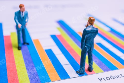 Preview: Miniature People : Businessman Standing On A Paper Graph Chart ,Developing A Teamwork Concept