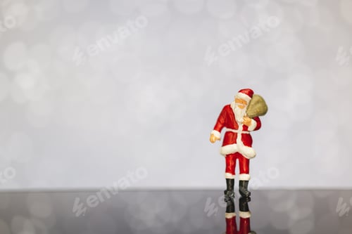 Preview: Miniature People : Santa Claus Carrying Bag On Bokeh Background , Merry Christmas And Happy New