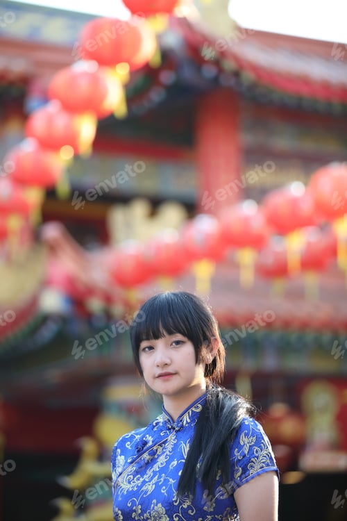 Preview: Beauty Woman Wear Red Cheongsam Looking And Smile In Chinese New Year