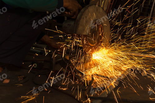Preview: Worker Use Electric Grinder Cutting Metal With Sparks In Workshop