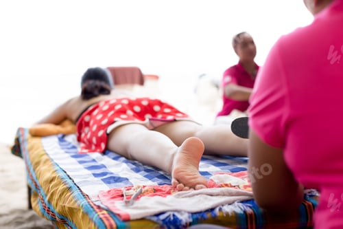 Preview: Woman Having Foot Scrub On The Beach