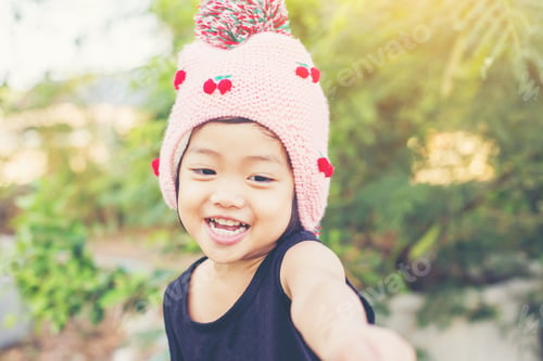 Preview: Little Cute Asian Girl Standing Among The Purple Flower Field Sunshine Day. Freedom Enjoying With