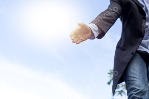Preview: Help Concept Hand Reaching Out To Helping Someone With Sunlight In Background