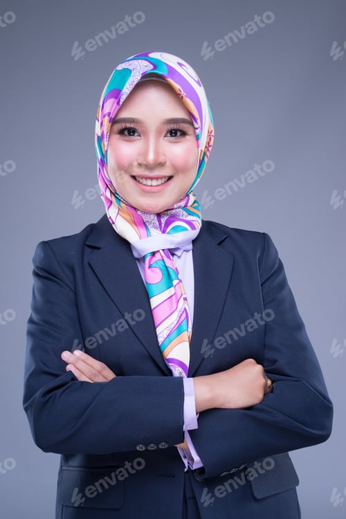 Preview: Half Length Portrait Of An Attractive Muslim Woman Wearing Business Attire And Hijab With Mixed