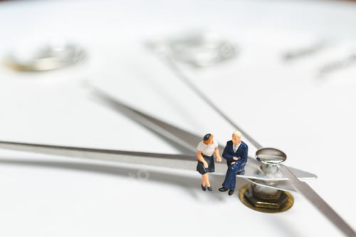 Preview: Miniature People Businessman Sitting On Clock , Concept Of Time And Work